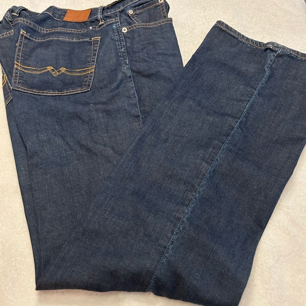 Lucky Brand Dark Blue Jeans with Brown Patch size 14